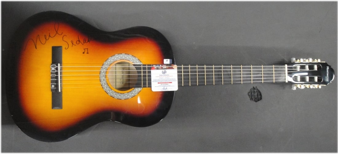 Neil Sedaka Autographed Acoustic Guitar with Global Authentics Authentication: Neil Sedaka Autographed Acoustic Guitar with Global Authentics Authentication This is a Neil Sedaka hand-signed acoustic guitar, authenticated by Global Authentics (GAI). This original item showcases 