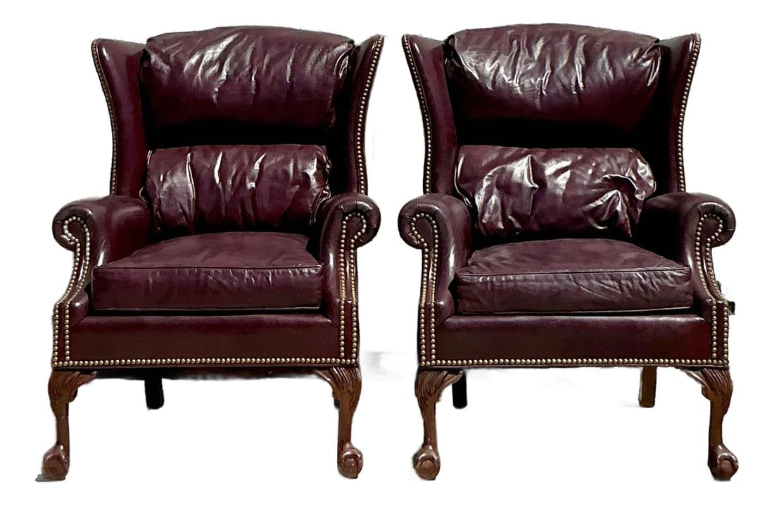 Pair of Vintage Regency Merlot Leather Wingback Chairs: Pair of Vintage Regency Merlot Leather Wingback Chairs Make a bold and timeless statement with this pair of Vintage Regency-style wingback chairs, richly upholstered in deep merlot leather. The high b