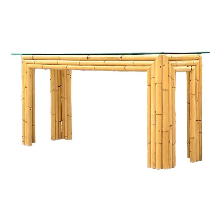 Vintage Coastal Bamboo Console Table with Glass Top: Vintage Coastal Bamboo Console Table with Glass Top This striking vintage Coastal console table features a stylish stacked bamboo design that brings a touch of chic sophistication to any space. The cl
