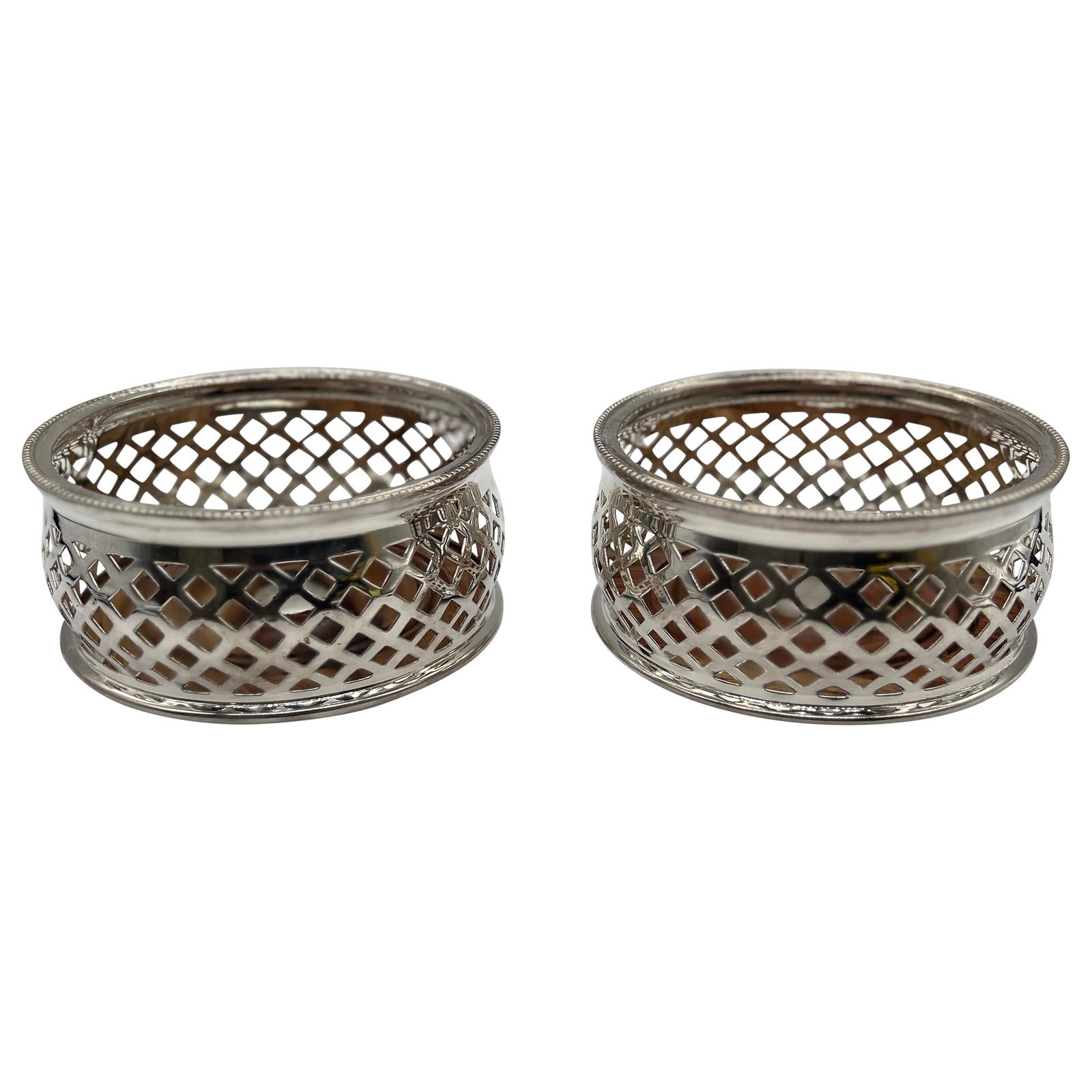 Set of 2 Vintage Silver Plated Bottle Holders Coasters England: Set of 2 Vintage Silver Plated Bottle Holders Coasters England This elegant pair of vintage English Royal Castle bottle holders or coasters is crafted from high-quality silver plate, showcasing a beau