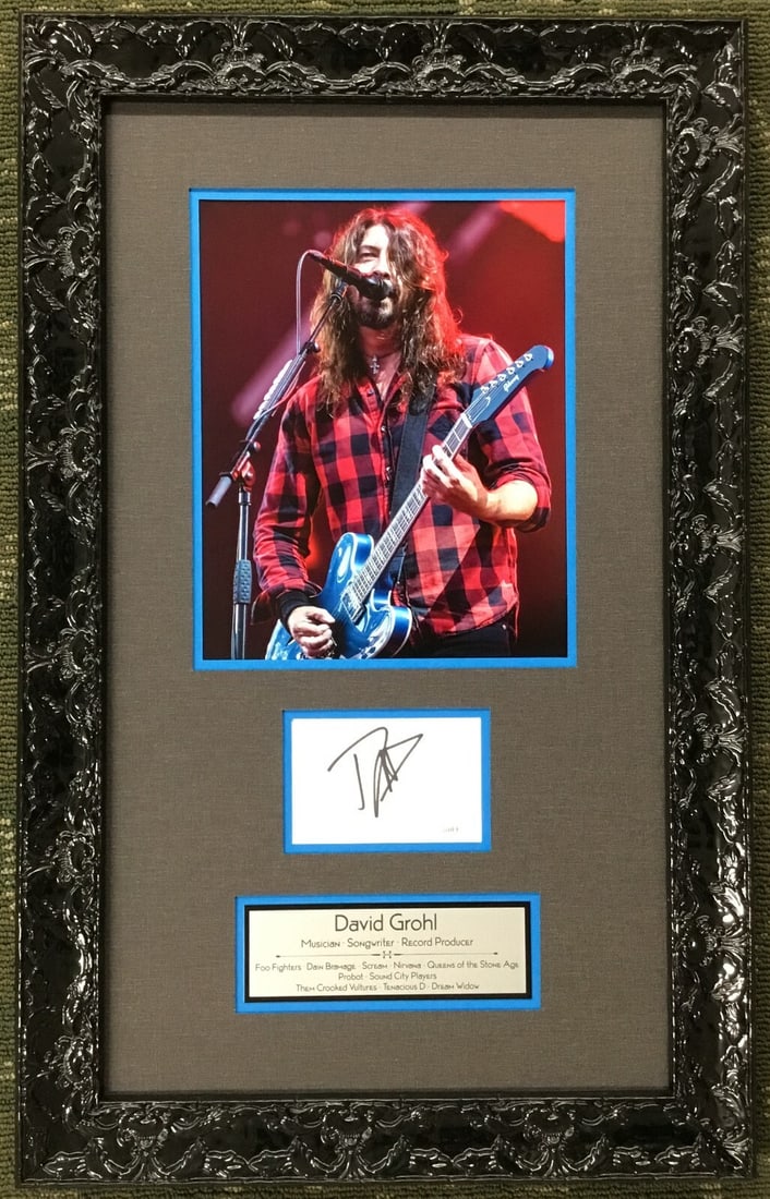David Grohl Signed Cut Card Photograph Custom Framed JSA Authenticated: David Grohl Signed Cut Card Photograph Custom Framed JSA Authenticated This stunning custom-framed photograph features a signed cut card by David Grohl, known for his iconic roles in both Foo Fighters