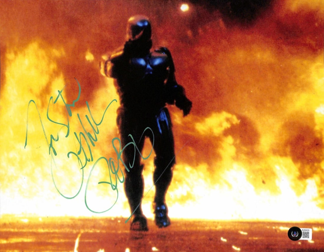 Peter Weller Signed 11x14 RoboCop Photo Beckett Certified: Peter Weller Signed 11x14 RoboCop Photo Beckett Certified This striking 11x14 photograph features Peter Weller, known for his iconic role as "RoboCop," and is beautifully signed in green permanent mar