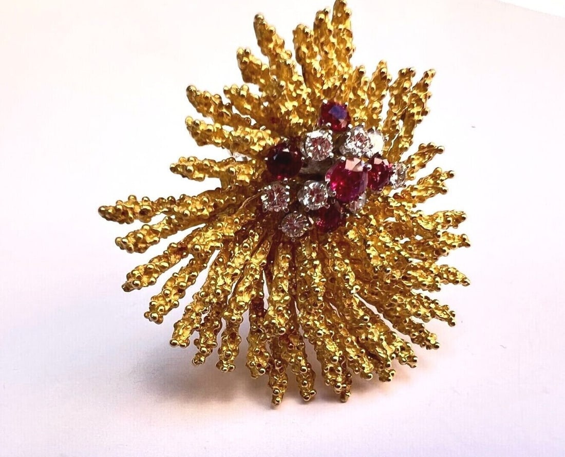 18K Yellow Gold Ruby Diamond Brooch Signed 18K ZVI: 18K Yellow Gold Ruby Diamond Brooch Signed 18K ZVI This exquisite 18K yellow gold brooch features a stunning combination of diamonds and rubies, showcasing a signed craftsmanship by "18K ZVI". This pi