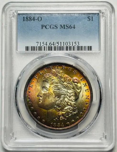 1884 O Morgan Dollar PCGS MS64 Uncirculated Rainbow Effect: 1884 O Morgan Dollar PCGS MS64 Uncirculated Rainbow Effect This stunning 1884 O Morgan Silver Dollar is certified by PCGS with a grade of MS 64, indicating its uncirculated condition. Minted in New Or