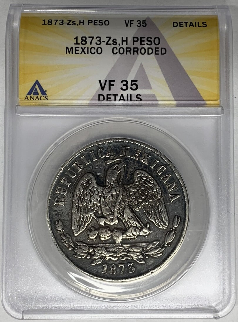 1873 Mexico Peso Coin ANACS VF 35 Silver Corroded: 1873 Mexico Peso Coin ANACS VF 35 Silver Corroded This 1873 Mexico Peso Coin is certified by ANACS and graded as VF 35. It belongs to the historical period of the Second Republic (1867-1905) and is co