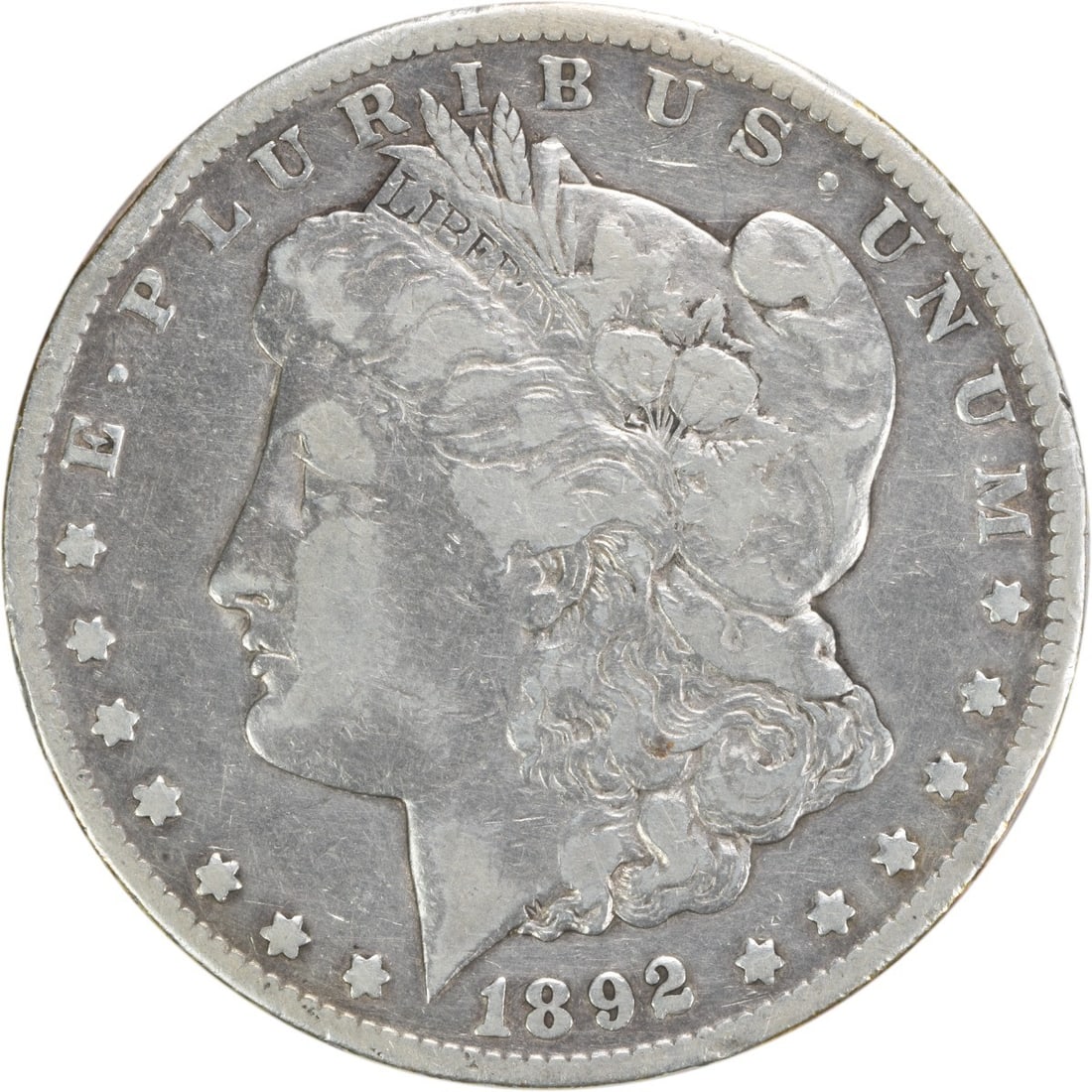 1892-CC Morgan Silver Dollar Uncertified 90% Silver Coin: 1892-CC Morgan Silver Dollar Uncertified 90% Silver Coin This 1892-CC Morgan Silver Dollar features a grade of F (Fine) and is part of the renowned Morgan series, designed by George T. Morgan. Minted 