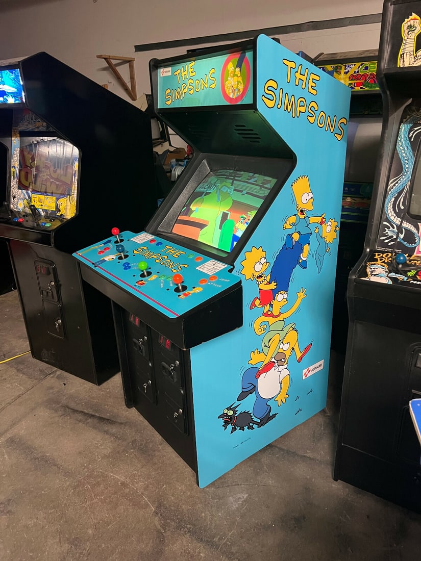 KONAMI 1991 The Simpsons 4 Player Arcade Machine: KONAMI 1991 The Simpsons 4 Player Arcade Machine Experience the nostalgia of classic gaming with THE SIMPSONS ARCADE MACHINE by KONAMI from 1991. This vibrant arcade machine is designed for 4 players,