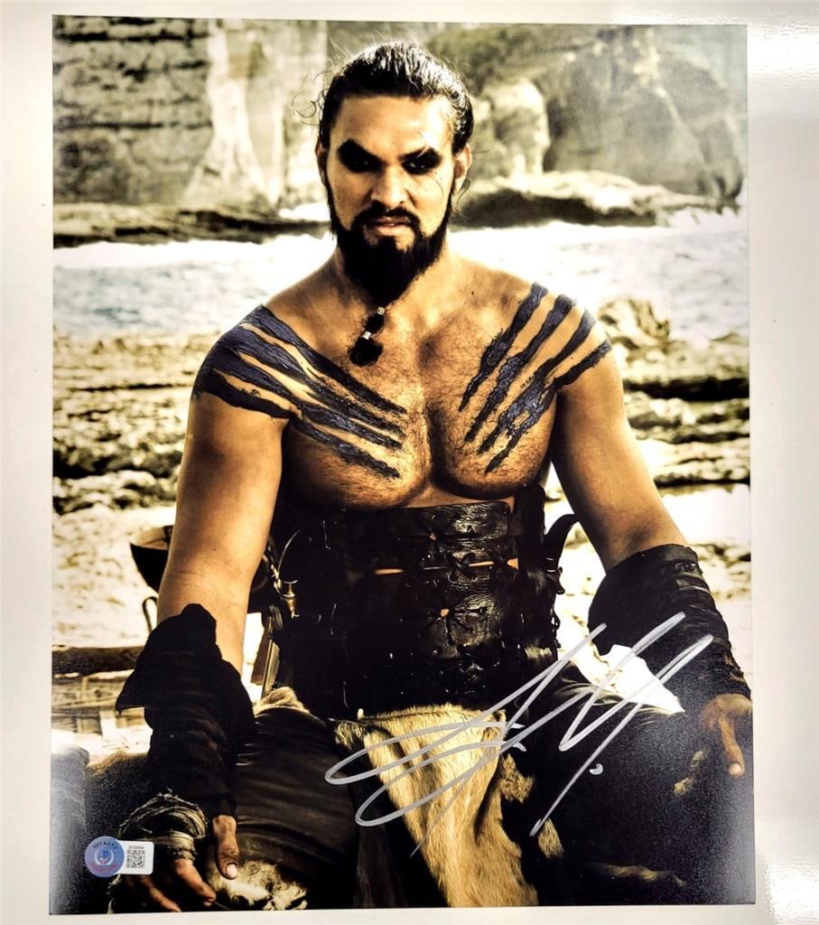 Jason Momoa Autographed Game of Thrones Khal Drogo 11x14 Photo Beckett Certified: Jason Momoa Autographed Game of Thrones Khal Drogo 11x14 Photo Beckett Certified Capture a piece of television history with this original 11x14 photo of Jason Momoa as Khal Drogo from the iconic serie