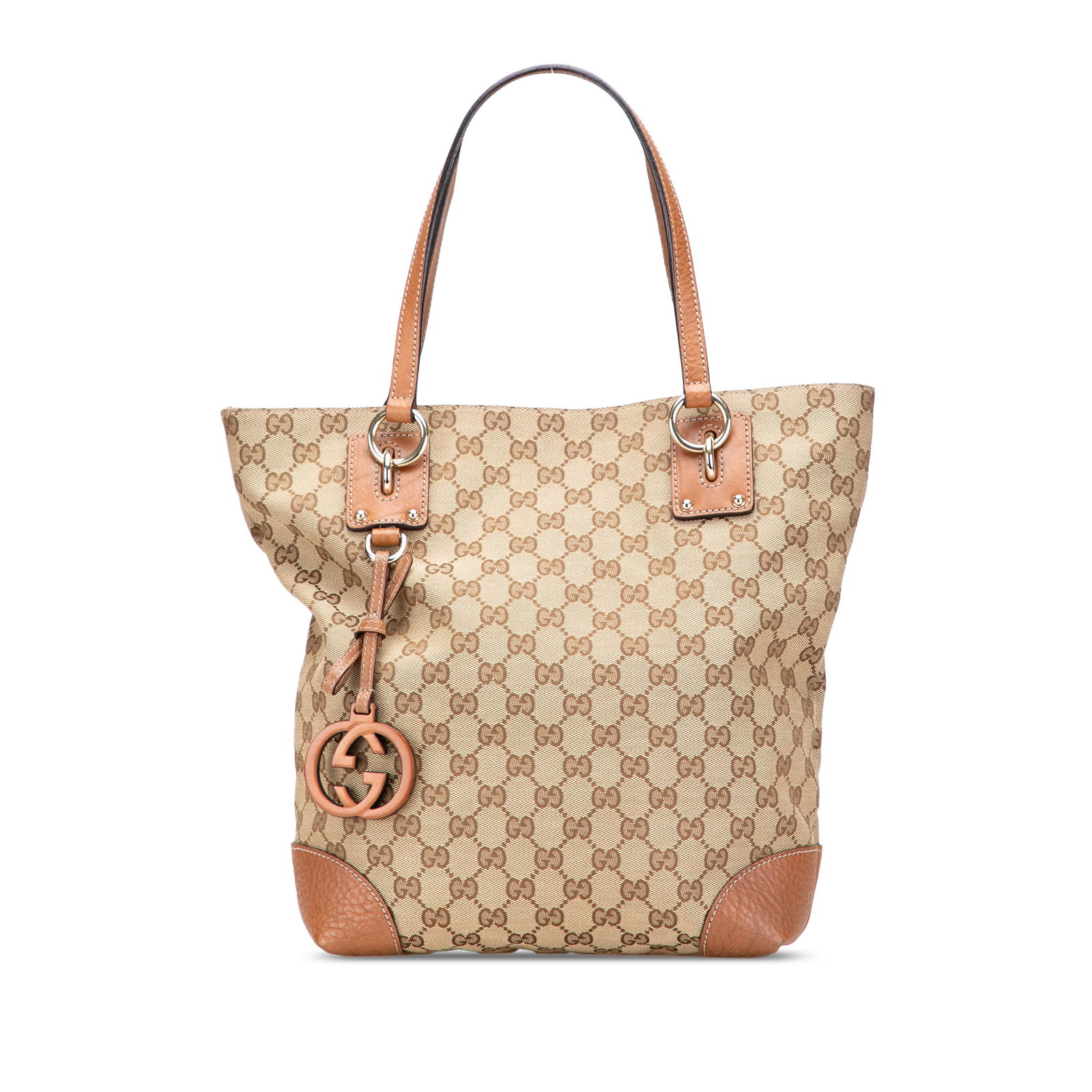 Gucci GG Canvas Tote with Leather Trim and Charm: Gucci GG Canvas Tote with Leather Trim and Charm This stylish Gucci GG Canvas GG Charm Tote is crafted with a durable canvas body and elegant leather trim. It showcases the iconic GG charm and feature