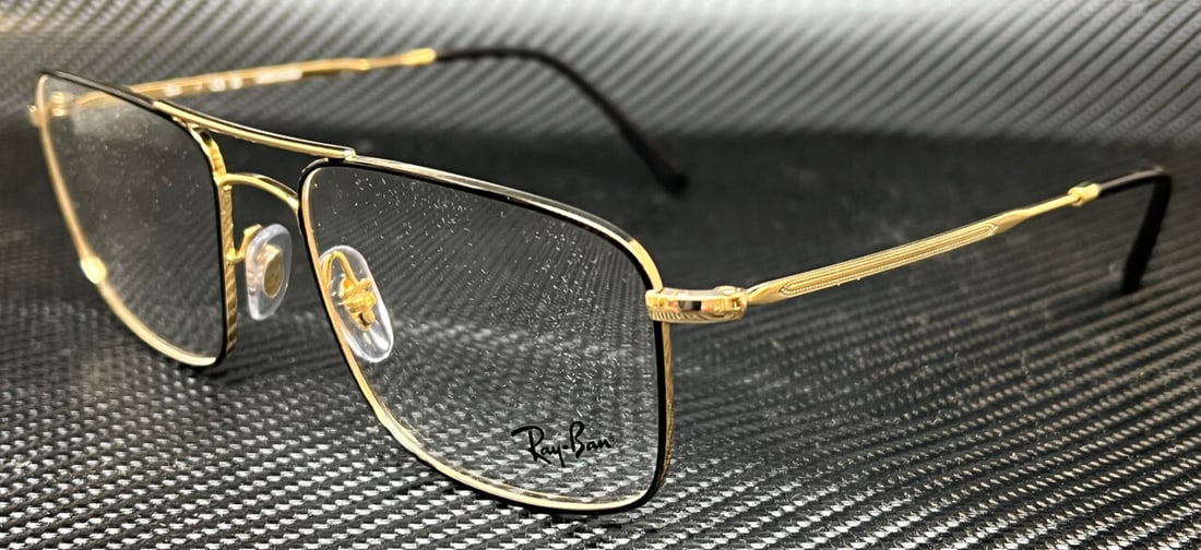Ray-Ban RX6434 2946 Black Gold Unisex 55mm Eyeglasses with Case: Ray-Ban RX6434 2946 Black Gold Unisex 55mm Eyeglasses with Case Discover the stylish Ray-Ban RX6434 2946 eyeglasses, designed for both men and women. These sleek frames feature a sophisticated black a