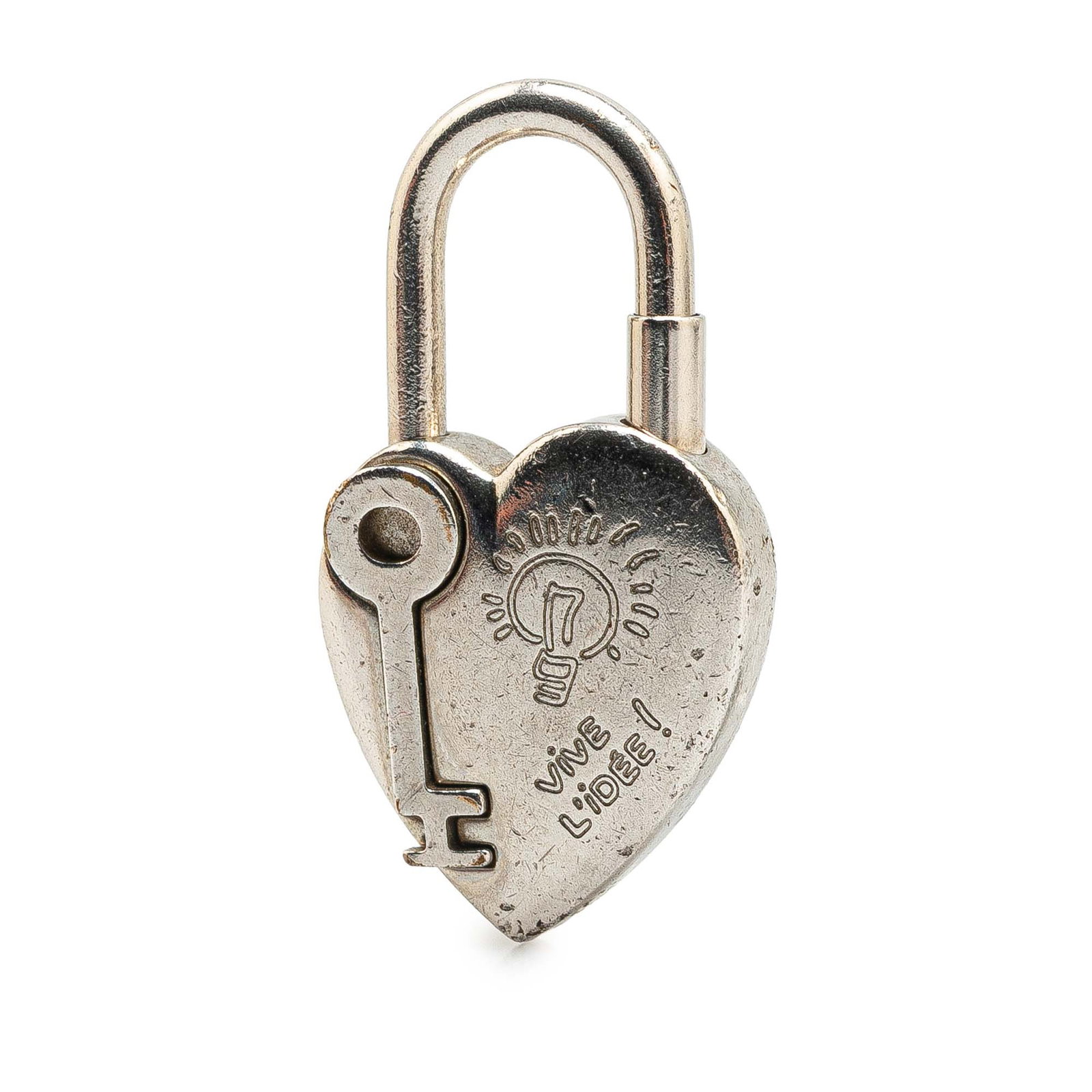 Hermes Annee De La Fantaisie Heart Cadena Lock Charm Silver: Hermes Annee De La Fantaisie Heart Cadena Lock Charm Silver This exquisite charm features a palladium-plated metal padlock with intricate engravings and a functional spinning lock mechanism. The charm