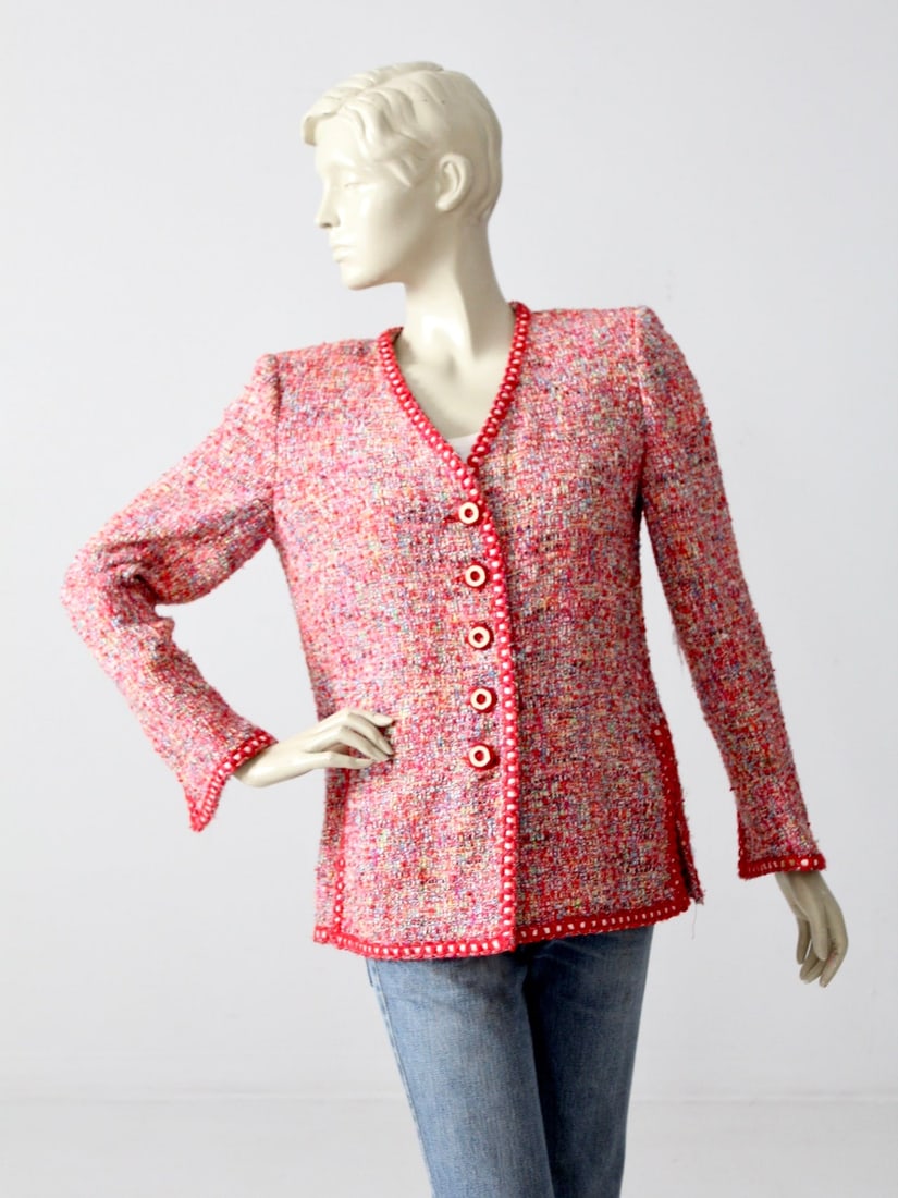 Emanuel Ungaro Vintage Red Tweed Blazer with Knit Trim: Emanuel Ungaro Vintage Red Tweed Blazer with Knit Trim Elevate your wardrobe with this Vintage Emanuel Ungaro Blazer, a stunning piece from our Stylist's Collection. This exquisite blazer is crafted f