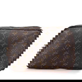 Louis Vuitton Monogram Trousse Toilette 23 Brown Fabric Bag: Louis Vuitton Monogram Trousse Toilette 23 Brown Fabric Bag This Louis Vuitton Monogram Trousse Toilette 23 is a stylish and functional bag crafted from iconic monogram canvas. It features a convenien