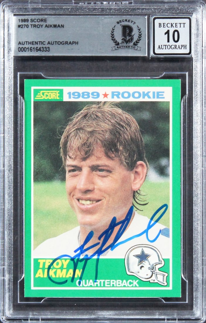 Troy Aikman Signed 1989 Score Rookie Card Gem Mint 10 Beckett Authenticated: Troy Aikman Signed 1989 Score Rookie Card Gem Mint 10 Beckett Authenticated This is a 1989 Score #270 Rookie Card featuring Troy Aikman, personally signed by the legendary Dallas Cowboys quarterback. 