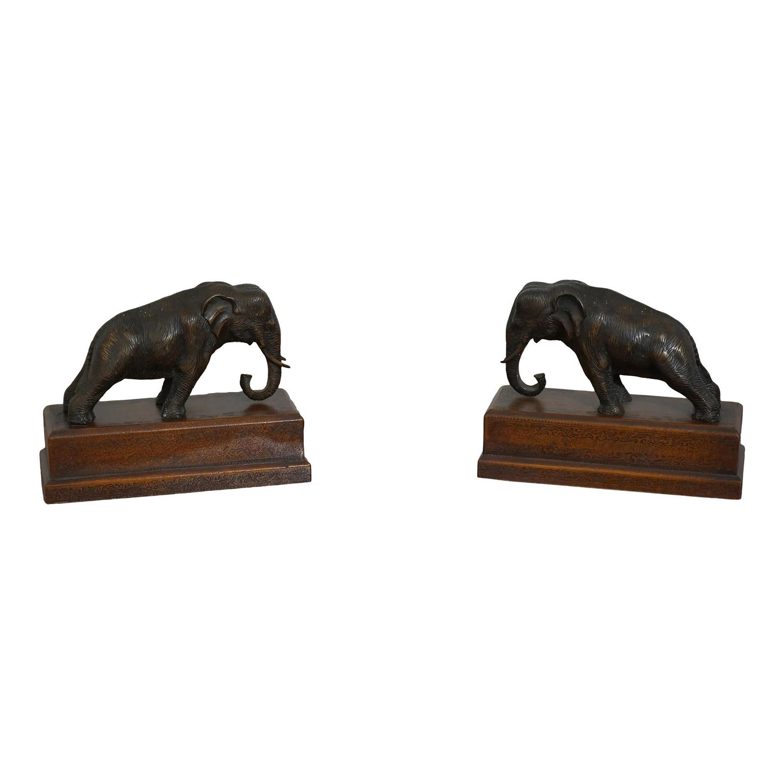 Theodore Alexander Bronze Elephant Bookends on Leather Bases: Theodore Alexander Bronze Elephant Bookends on Leather Bases Enhance your library or display with this elegant pair of Theodore Alexander bookends, featuring intricately crafted bronze elephants mount