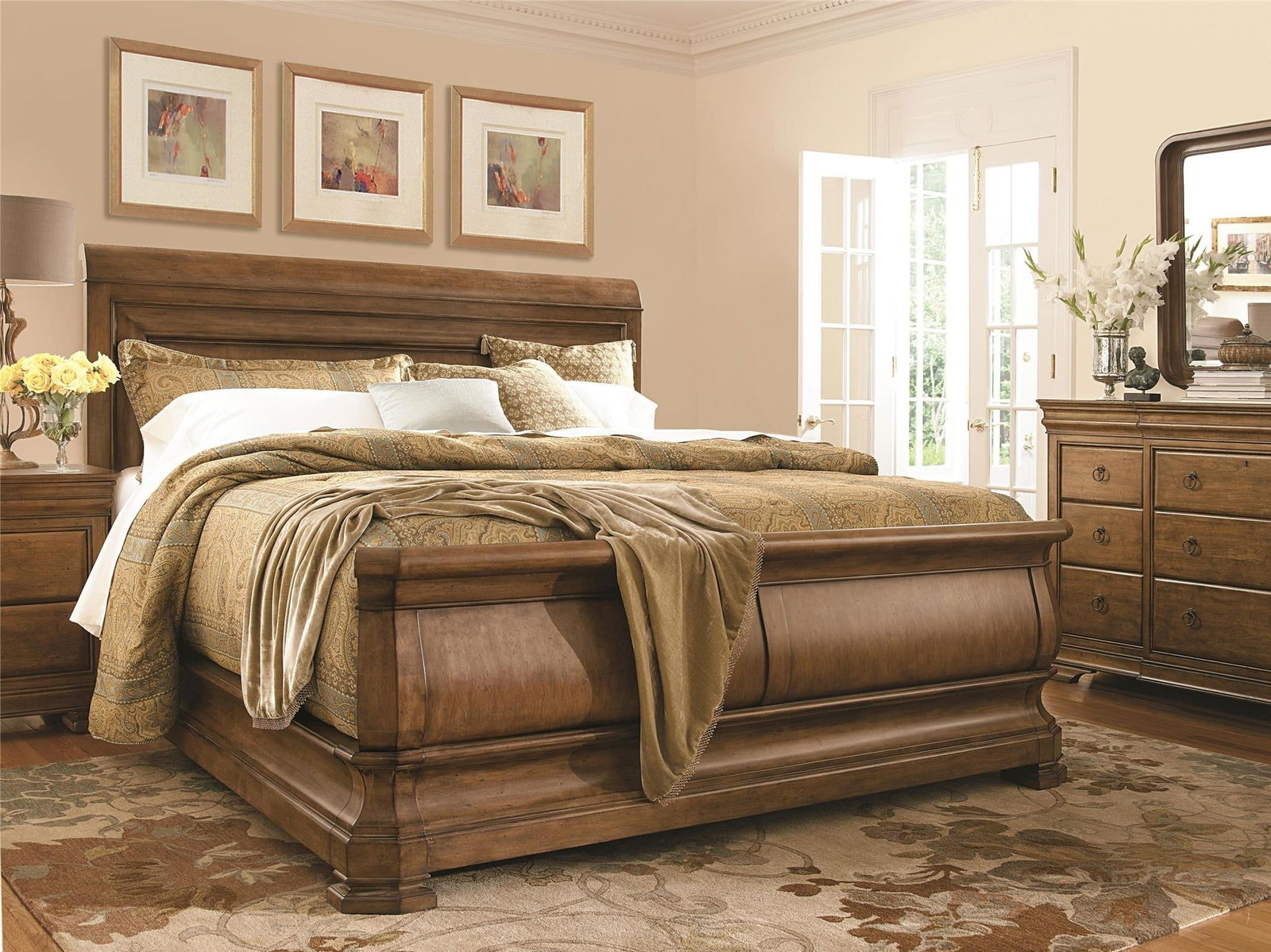 Universal Louie P King Sleigh Bed Cognac Finish 60H 86W 96D: Universal Louie P King Sleigh Bed Cognac Finish 60H 86W 96D Introducing the Louie P's King Sleigh Bed, crafted from rich cognac wood, providing a warm and inviting focal point for your bedroom. This e