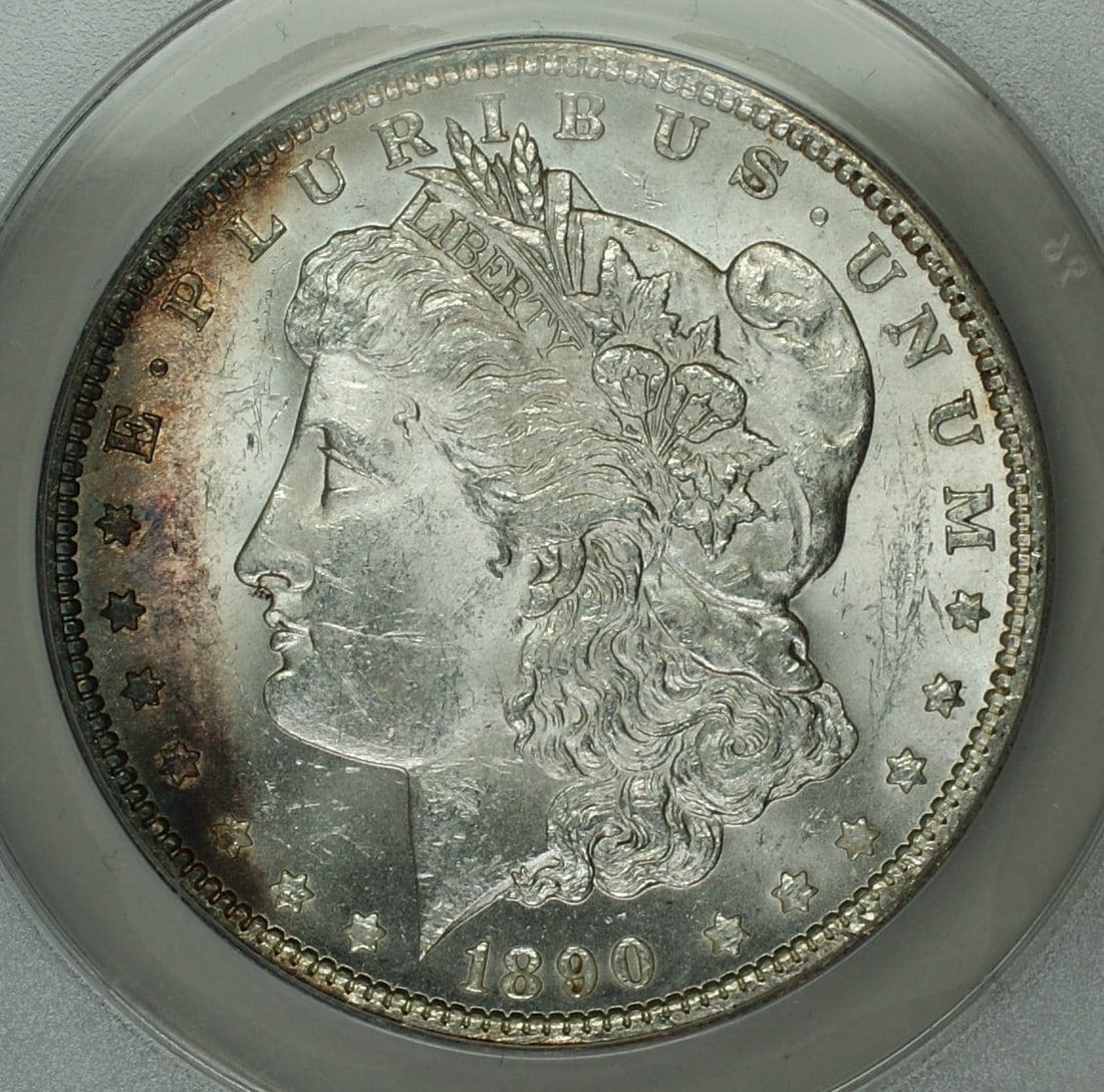 1890 Morgan Silver Dollar ANACS MS62 Toned Coin Philadelphia Mint: 1890 Morgan Silver Dollar ANACS MS62 Toned Coin Philadelphia Mint This 1890 Morgan Silver Dollar $1 Coin features a stunning uncirculated grade of MS-62, certified by ANACS. Minted in Philadelphia, th
