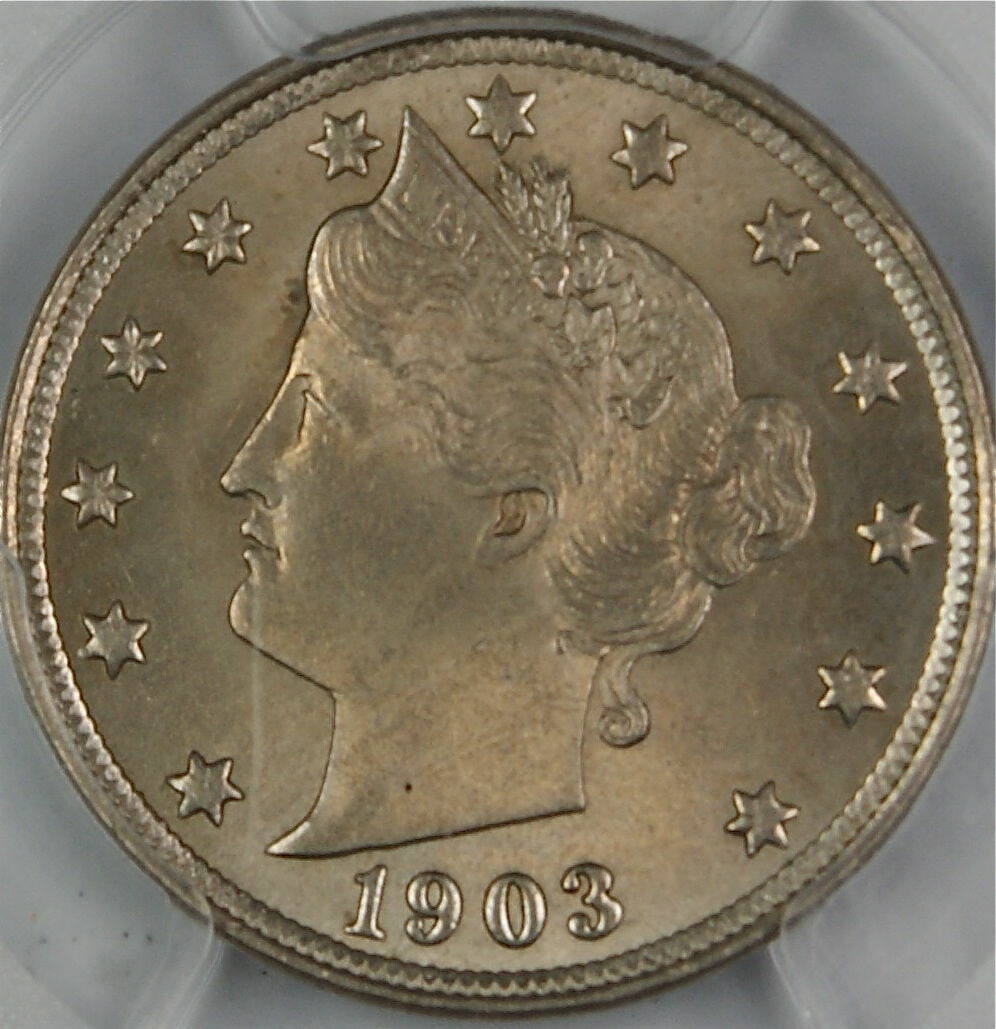 1903 Liberty Nickel Coin PCGS MS-64 Uncirculated Philadelphia: 1903 Liberty Nickel Coin PCGS MS-64 Uncirculated Philadelphia This 1903 Liberty Nickel coin, certified by PCGS as MS-64, showcases a remarkable level of preservation. Minted in Philadelphia, this unci