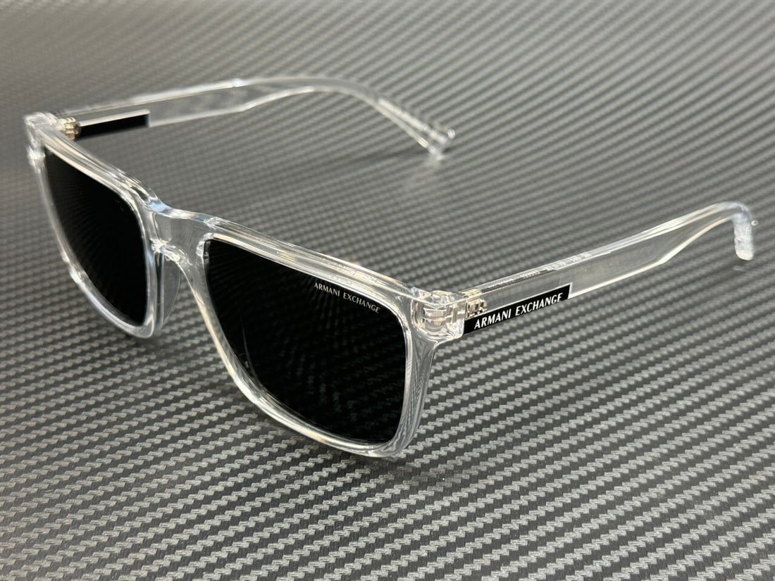 Armani Exchange AX4080S 823587 Shiny Crystal Grey Sunglasses with Authenticity: Armani Exchange AX4080S 823587 Shiny Crystal Grey Sunglasses with Authenticity Elevate your style with these Armani Exchange AX4080S sunglasses, featuring a sleek shiny crystal frame and dark grey len