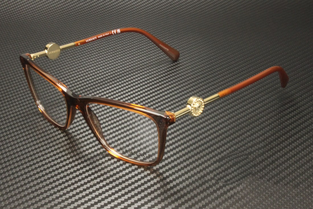 Versace VE3299B 5324 Transparent Brown Women's Eyeglasses with Authenticity Certificate: Versace VE3299B 5324 Transparent Brown Women's Eyeglasses with Authenticity Certificate Stylishly crafted by Versace, these eyeglasses feature a transparent brown rectangular frame that epitomizes mod