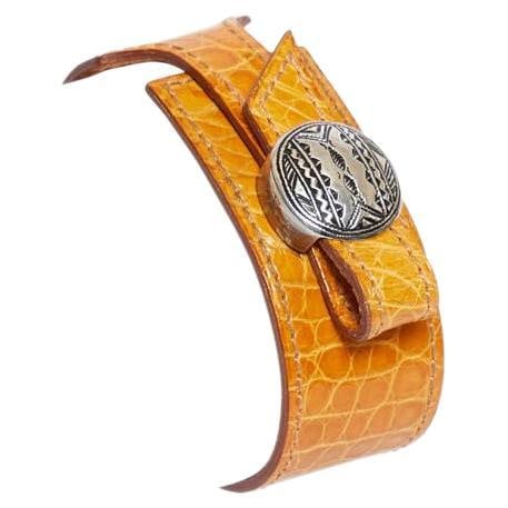 Hermes Touareg Rust Alligator Adjustable Sterling Silver Bracelet: Hermes Touareg Rust Alligator Adjustable Sterling Silver Bracelet Discover the elegance of the Hermes Touareg Rust Alligator Bracelet, crafted from high-quality sterling silver. This exquisite piece f