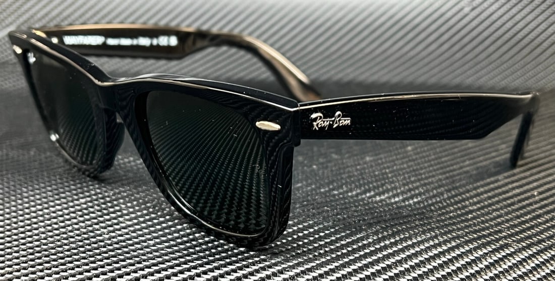 Ray-Ban RB2140 135831 Black Green Unisex Sunglasses with Case: Ray-Ban RB2140 135831 Black Green Unisex Sunglasses with Case Introducing the Ray-Ban RB2140 135831 sunglasses, a stylish accessory for anyone looking to elevate their eyewear collection. These unisex