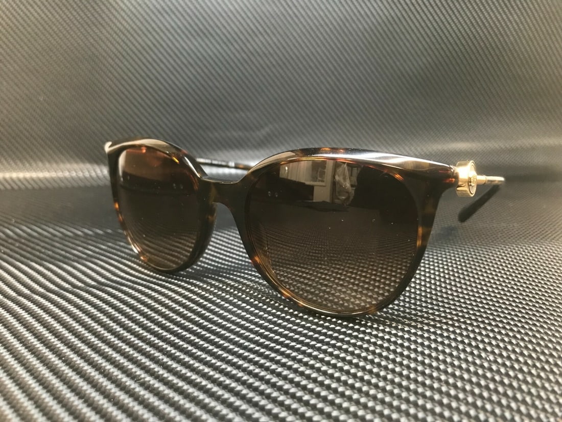 Versace VE4404 108 74 Havana Round Sunglasses with Brown Gradient Lenses: Versace VE4404 108 74 Havana Round Sunglasses with Brown Gradient Lenses Elevate your style with these Versace VE4404 108 74 round sunglasses, perfect for the fashion-forward woman. Crafted in Italy,