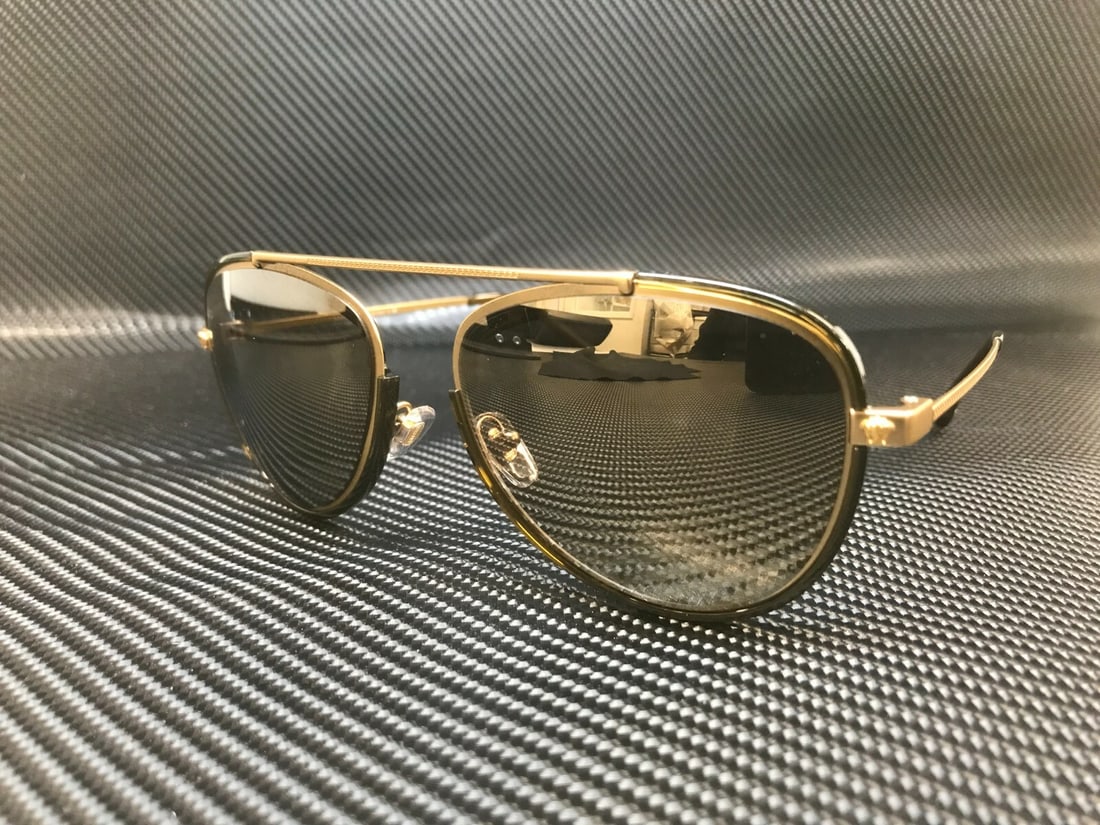 Versace VE2193 14285A Gold Phantos Sunglasses with Brown Mirror Lenses: Versace VE2193 14285A Gold Phantos Sunglasses with Brown Mirror Lenses Elevate your style with the Versace VE2193 14285A Tribute Gold Mirror Sunglasses. These men's phantos sunglasses feature a striki