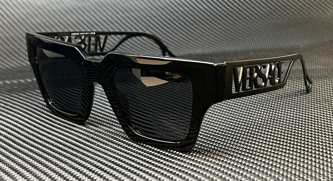 Versace VE4431F 538087 Black Grey Women's Sunglasses 50mm: Versace VE4431F 538087 Black Grey Women's Sunglasses 50mm Elevate your style with these Versace VE4431F 538087 sunglasses, designed for women. Featuring a sleek black frame that complements the grey l