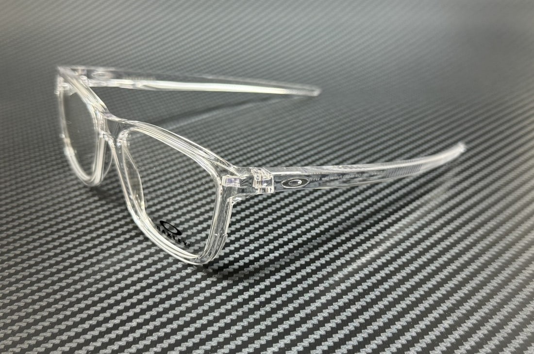 Oakley OX8163 0353 Polished Clear 53mm Men's Eyeglasses with Original Case: Oakley OX8163 0353 Polished Clear 53mm Men's Eyeglasses with Original Case Discover the stylish OAKLEY OX8163 0353 eyeglasses, featuring a polished clear frame designed for men. These eyeglasses come