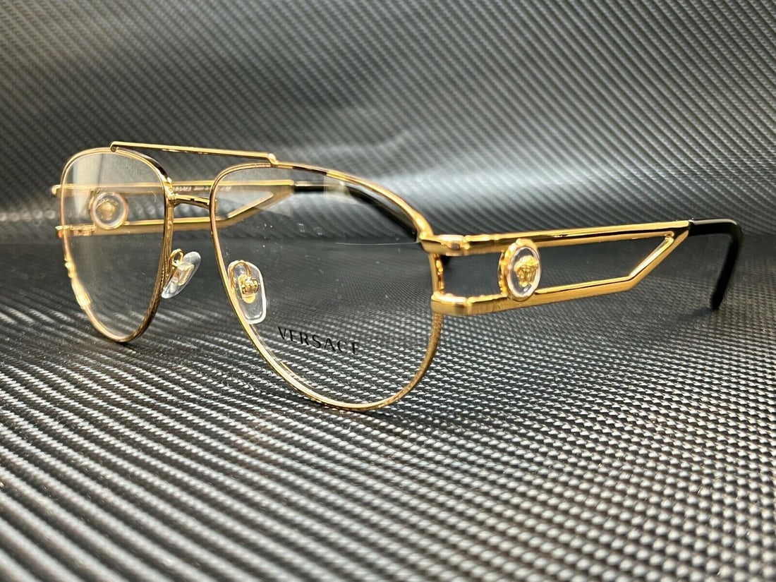 Versace VE1269 1002 Gold Aviator Eyeglasses with Authenticity Certificate: Versace VE1269 1002 Gold Aviator Eyeglasses with Authenticity Certificate Discover the elegance of Versace with the VE1269 1002 Gold Pilot Men's Eyeglasses. These aviator-style eyeglasses feature a st