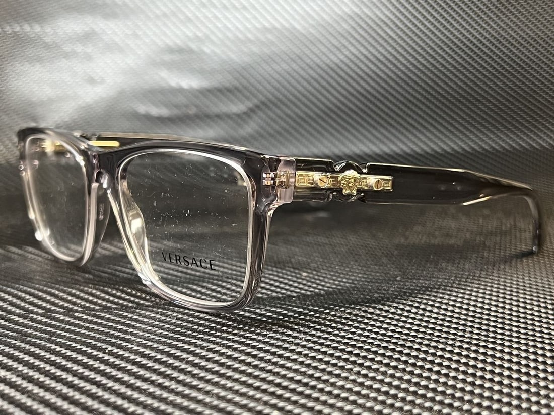 Versace VE3303 593 Transparent Grey Rectangle Eyeglasses with Clear Lenses: Versace VE3303 593 Transparent Grey Rectangle Eyeglasses with Clear Lenses Discover the elegance of Versace with these VE3303 593 eyeglasses. Designed for men, these stylish rectangular frames feature