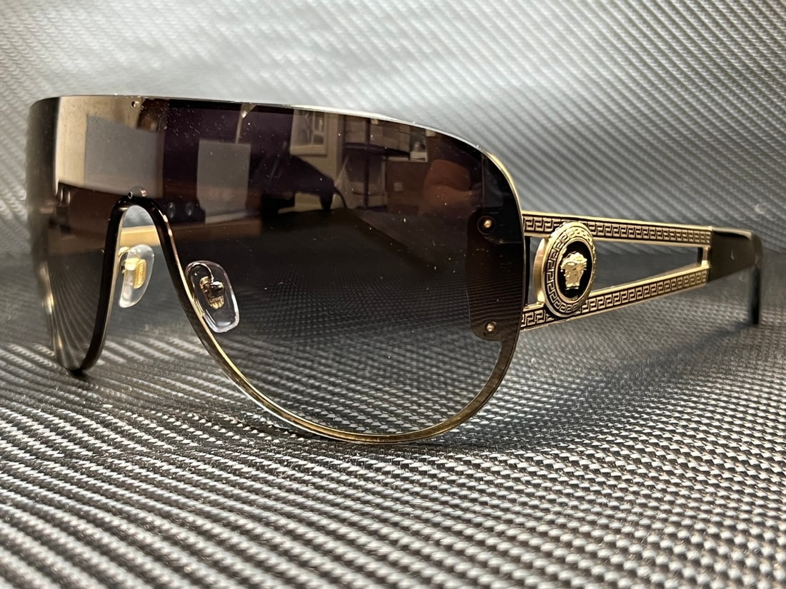 Versace VE2166 12528G Pale Gold Women's Shield Sunglasses: Versace VE2166 12528G Pale Gold Women's Shield Sunglasses Elevate your style with these VERSACE VE2166 12528G Pale Gold Pilot Sunglasses, designed specifically for women. Featuring a chic shield style