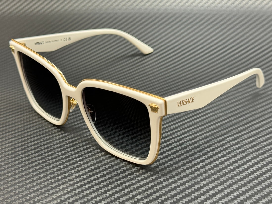 Versace VE2278D 314 8G White Grey Gradient Sunglasses: Versace VE2278D 314 8G White Grey Gradient Sunglasses Introducing the Versace VE2278D 314 8G women's sunglasses, featuring a stylish white frame complemented by grey gradient lenses. These sunglasses