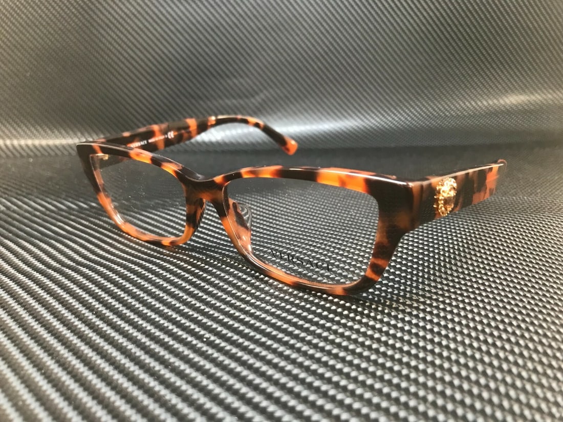 Versace VE3284BA 944 Havana Women's Eyeglasses with Demo Lenses: Versace VE3284BA 944 Havana Women's Eyeglasses with Demo Lenses Introducing the Versace VE3284BA 944 Women's Eyeglasses, featuring a stylish Havana frame crafted in Italy. These eyeglasses come with d