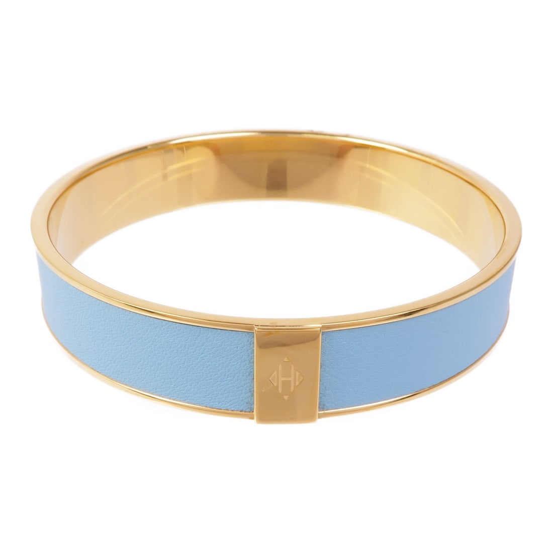 HERMES Gold Tone Bracelet Made in France: HERMES Gold Tone Bracelet Made in France This elegant HERMES bracelet features a stunning gold tone that adds a touch of luxury to any outfit. Crafted in France, this piece showcases a regular size su