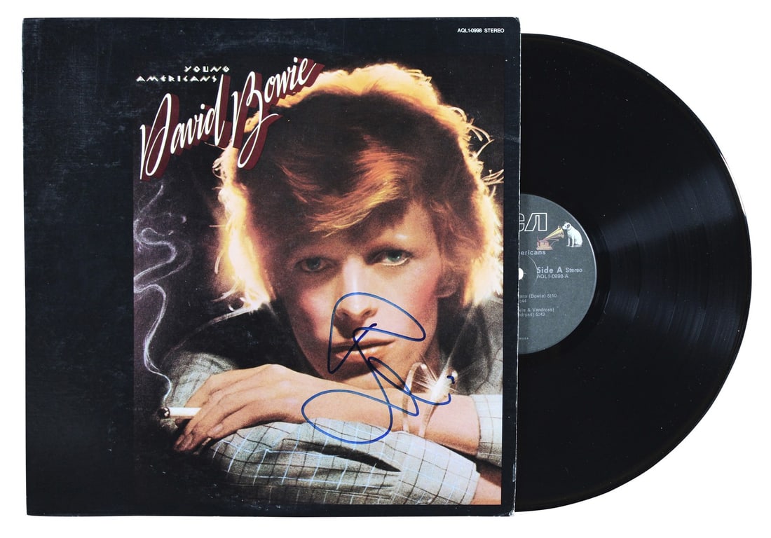David Bowie Signed Young Americans Album Cover with Vinyl Beckett Authenticated: David Bowie Signed Young Americans Album Cover with Vinyl Beckett Authenticated This is an authentic signed album cover of David Bowie's iconic 'Young Americans,' complete with the vinyl record. The c