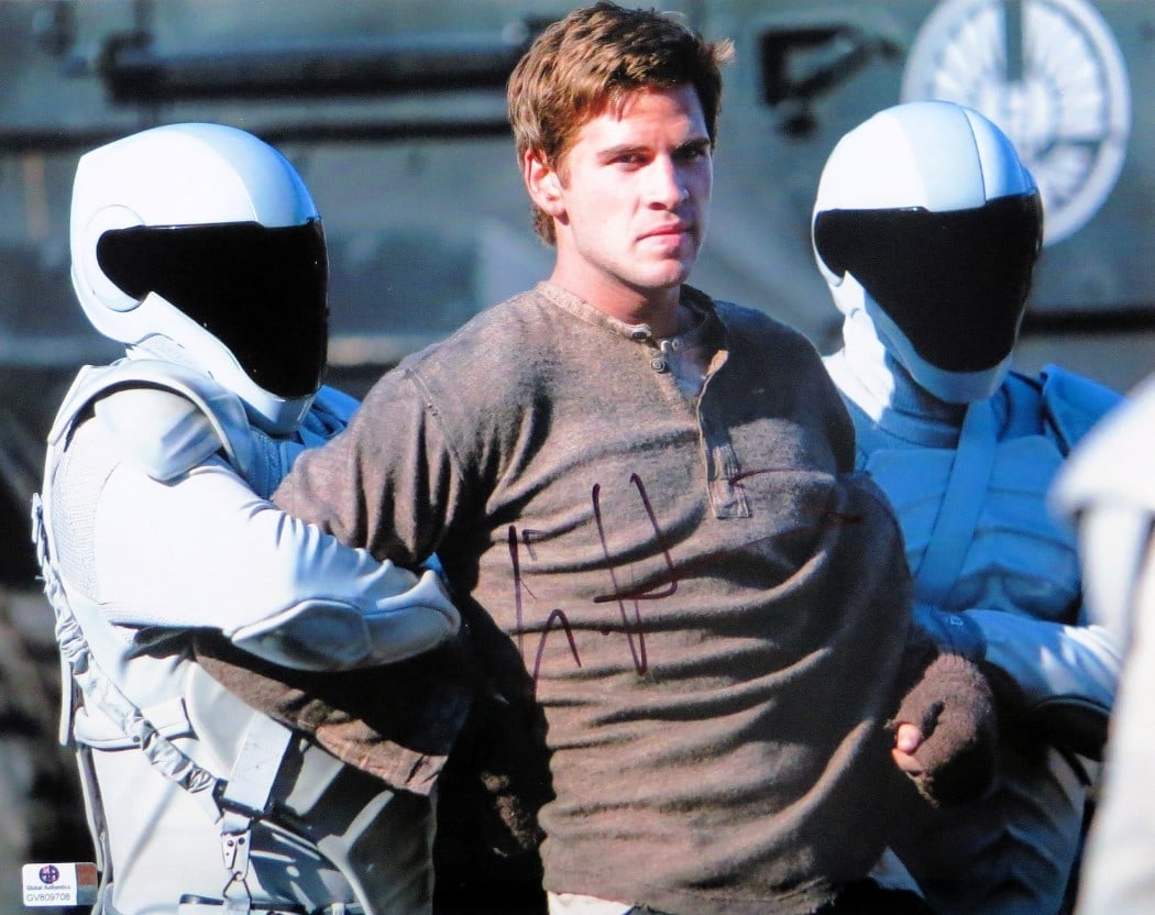 Liam Hemsworth Autographed 11X14 Photo The Hunger Games GAI Authenticated: Liam Hemsworth Autographed 11X14 Photo The Hunger Games GAI Authenticated This is an authentic 11"x14" photograph signed by Liam Hemsworth, a prominent actor known for his role in 'The Hunger Games.'