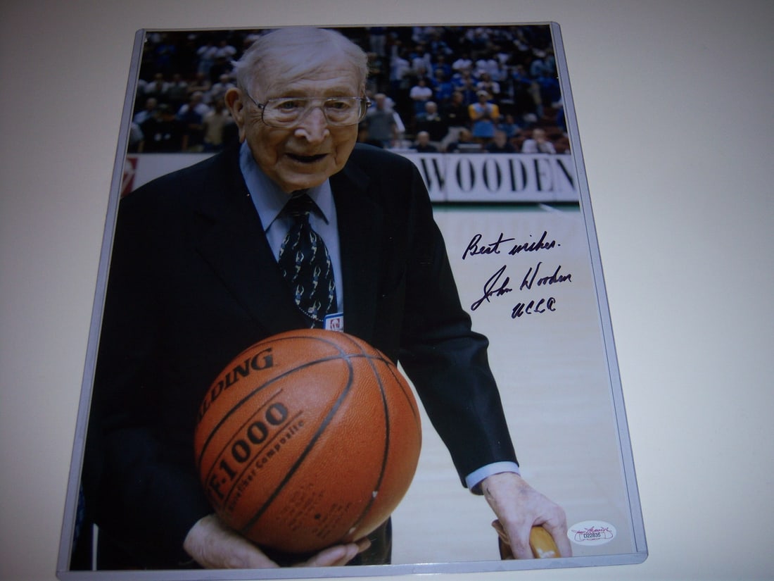 John Wooden Signed 11x14 UCLA Bruins Photo with JSA COA: John Wooden Signed 11x14 UCLA Bruins Photo with JSA COA Capture a piece of basketball history with this original 11x14 photograph signed by the legendary John Wooden, a Hall of Fame coach of the UCLA