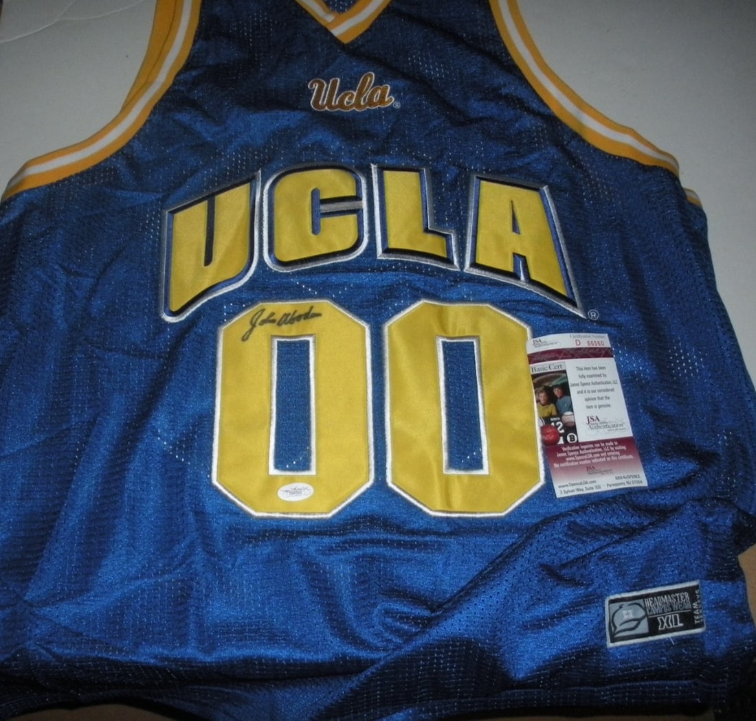 John Wooden Signed UCLA Bruins Jersey JSA COA Original Authentic: John Wooden Signed UCLA Bruins Jersey JSA COA Original Authentic This is an original, pre-owned UCLA Bruins jersey signed by the legendary basketball coach John Wooden. It features an official license
