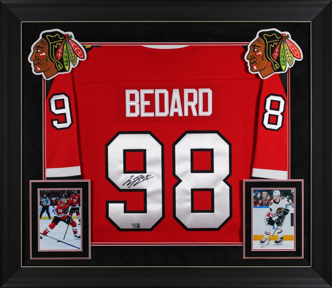 Connor Bedard Autographed Chicago Blackhawks Red Framed Jersey: Connor Bedard Autographed Chicago Blackhawks Red Framed Jersey Celebrate the rise of Connor Bedard with this authentically signed Chicago Blackhawks red Fanatics Breakaway jersey. This original item s