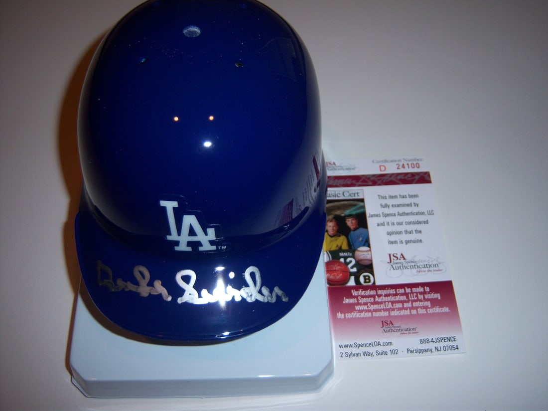 Duke Snider Dodgers Signed Mini Helmet with JSA COA: Duke Snider Dodgers Signed Mini Helmet with JSA COA This authentic mini helmet is signed by legendary baseball player Duke Snider, a prominent figure in MLB history. The helmet showcases Snider's auto