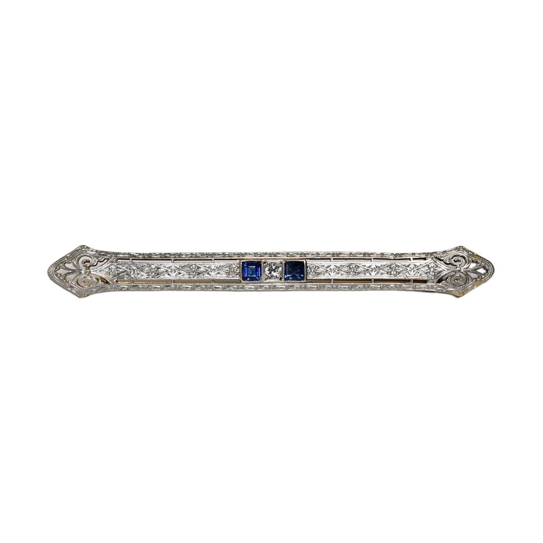 Art Deco Antique Brooch in 14K Gold and Platinum with Diamond and Blue Spinel: Art Deco Antique Brooch in 14K Gold and Platinum with Diamond and Blue Spinel This stunning antique brooch showcases a unique combination of 14K yellow gold and platinum, characteristic of the Art Dec