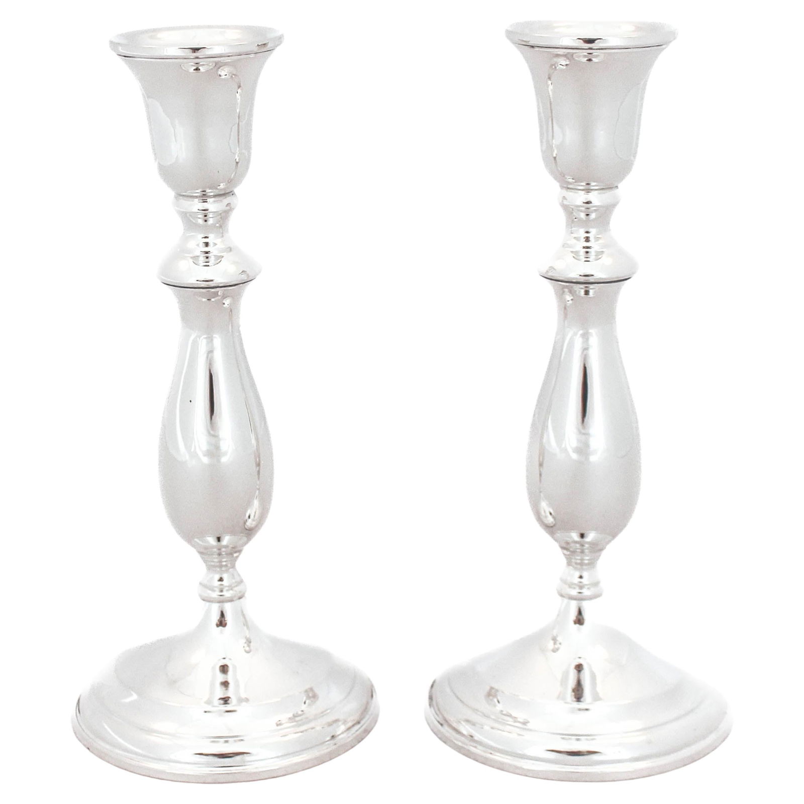 Redlich & Co Sterling Silver Candlesticks Set of 2 1940: Redlich & Co Sterling Silver Candlesticks Set of 2 1940 This elegant pair of sterling silver candlesticks, crafted by Redlich & Company during the 1940s, features a minimalist design that reflects the