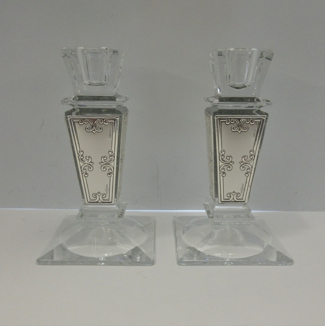 Italian Silver Plate Crystal Square Candlesticks Floral Design 5.5in: Italian Silver Plate Crystal Square Candlesticks Floral Design 5.5in This exquisite pair of candlesticks showcases a stunning floral chased pattern, crafted from high-quality silver plate and crystal.