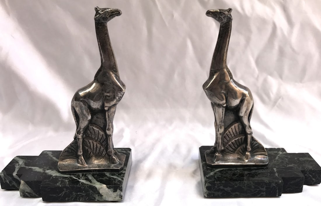 Art Deco Bronze Marble Bookends by Maurice Frecourt with Giraffes: Art Deco Bronze Marble Bookends by Maurice Frecourt with Giraffes Explore this exquisite pair of French Art Deco bookends, crafted from bronze and marble by the renowned artist Maurice Frecourt, born