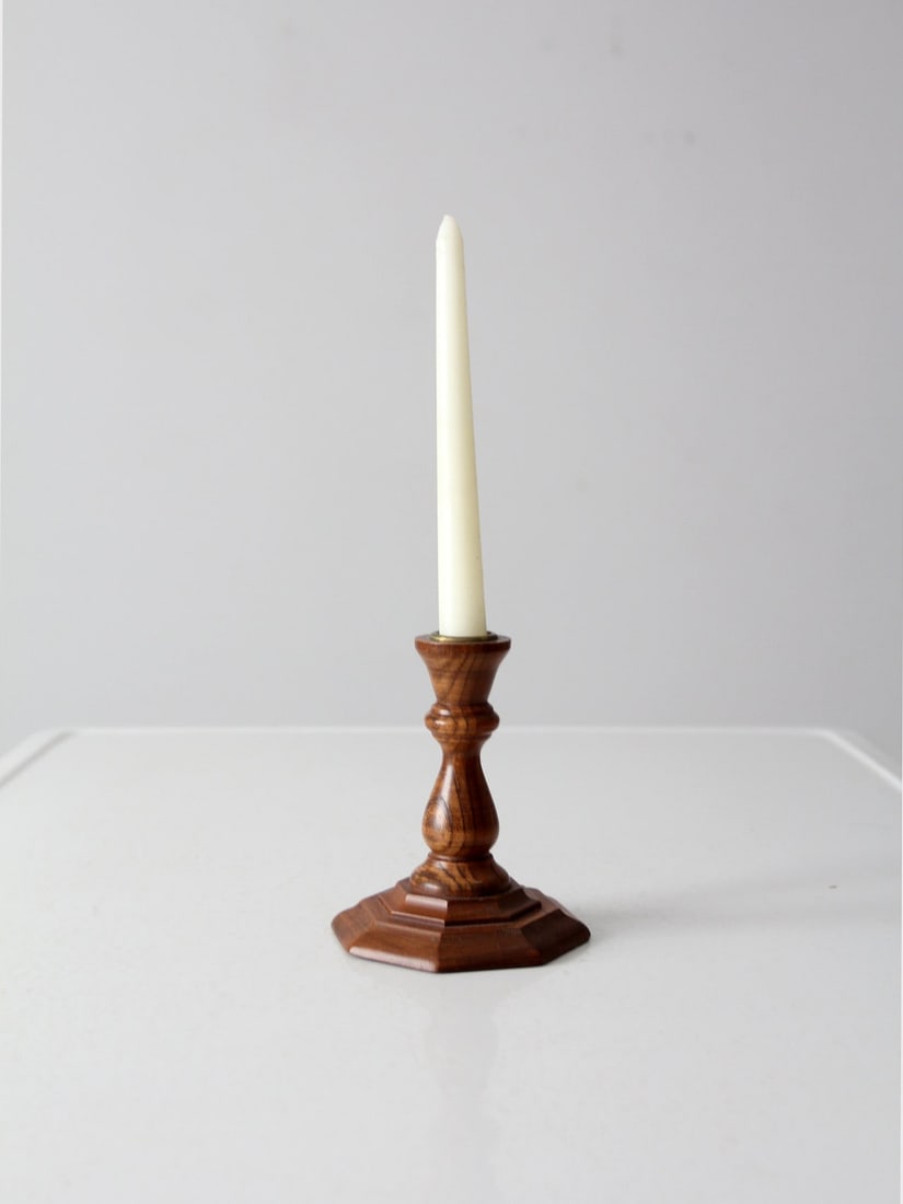 Vintage Wooden Candlestick Holder with Brass Socket 5.5in: Vintage Wooden Candlestick Holder with Brass Socket 5.5in This vintage wooden candlestick holder showcases a classic design with a stepped square base and a gracefully contoured baluster stem, topped