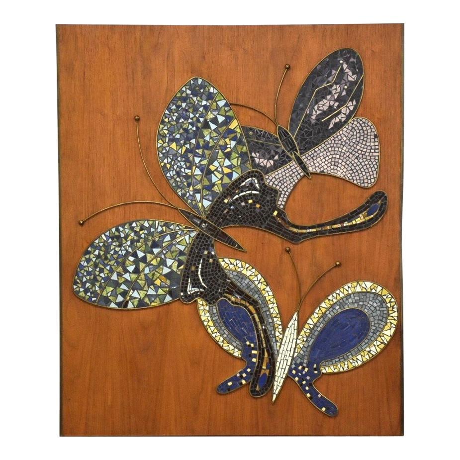 Mid Century Modern Ceramic Butterfly Wall Art on Walnut: Mid Century Modern Ceramic Butterfly Wall Art on Walnut This stunning mid-century modern wall art features a ceramic tile with a brass butterfly design elegantly mounted on a walnut panel. The piece m
