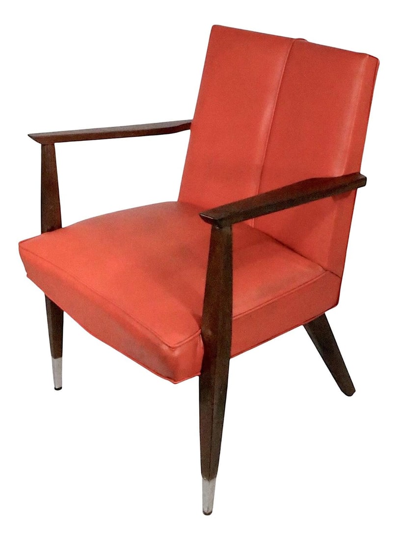 Mid Century V Back Arm Chair Orange Vinyl 1950s 1960s: Mid Century V Back Arm Chair Orange Vinyl 1950s 1960s This stylish mid-century V back arm chair, dating from the 1950s to 1960s, features a vibrant orange vinyl upholstery complemented by metal sabot 