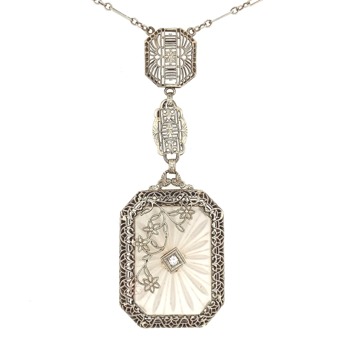 Art Deco 14k White Gold Rock Crystal Quartz Necklace with Diamond: Art Deco 14k White Gold Rock Crystal Quartz Necklace with Diamond This exquisite Art Deco necklace showcases a stunning 14k white gold pendant featuring a beautifully frosted and reverse carved rock c